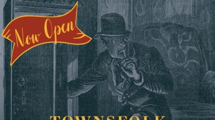 A vintage-style promotional graphic with a dark teal overlay featuring a 19th-century illustration of a thief. The man, wearing a bowler hat, glasses, and a neckerchief, holds a finger to his lips in a "shh" motion while peering into an open wooden safe. A red and gold ribbon banner in the top left corner reads "Now Open."  Large, bold text layered over the center of the image reads: "TOWNSFOLK WANTED TO SOLVE A GOLD HEIST AND CATCH NOTORIOUS THIEVES! Book your team today."