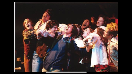A group a performers on stage.