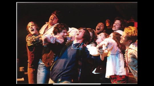 A group a performers on stage.